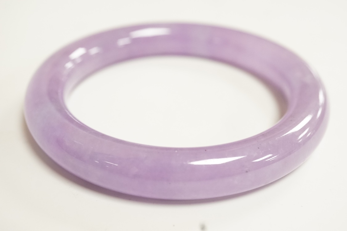 A lavender hardstone bangle, 8cm wide